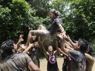 Mud-covered Nepalese youths play in a rice paddy field in Baande village on the outskirts of Kathmandu on June 29, 2016.
Farmers in Nepal celebrate National Paddy Day as the annual rice planting season begins. / AFP PHOTO / PRAKASH MATHEMA