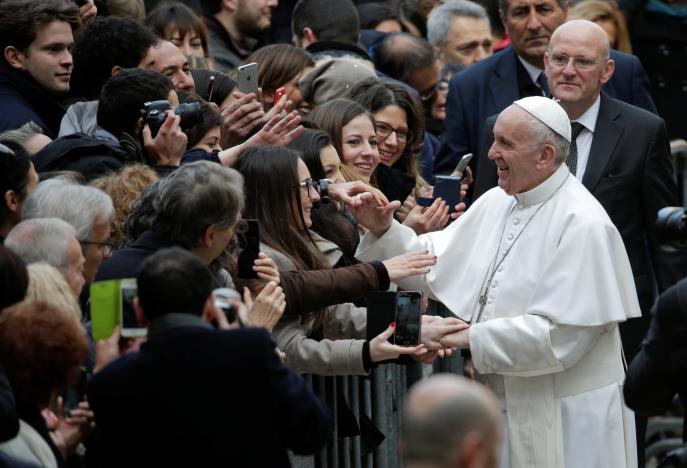 Pope Francis is welcomed by students as he arrives to attend a meeting at the University Roma Tre in Rome, Italy February 17, 2017. REUTERS/Max Rossi