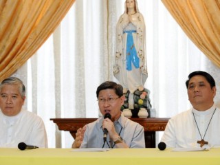 Senior Filipino Roman Catholic bishops Socrates Villegas (L), Luis Tagle (C) and Mylo Vergara (R) attend a press conference in Manila on July 7, 2014. Pope Francis is to visit the Philippines, Asia's bastion of the Catholic faith, in January 2015 to comfort victims of disasters such as Super Typhoon Haiyan, local church leaders said on July 7.   AFP PHOTO / Jay DIRECTO        (Photo credit should read JAY DIRECTO/AFP/Getty Images)