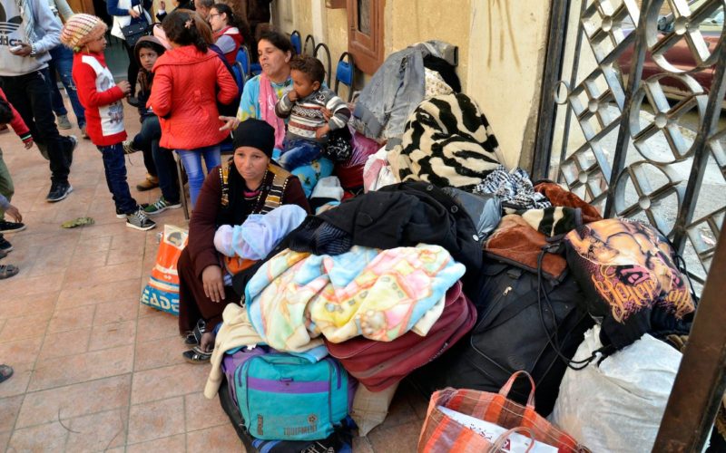 Displaced Egyptian Christian families, who used to live in the north of the Sinai Peninsula, sit near their belongings after arriving Feb. 24 at a church in Ismailia. Catholic churches in Ismailia, with help from Caritas, have helped Coptic Orthodox fleeing Islamic State attacks in North Sinai. (CNS photo/EPA) See EGYPT-ISIS-SINAI-CHRISTIANS March 3, 3017.