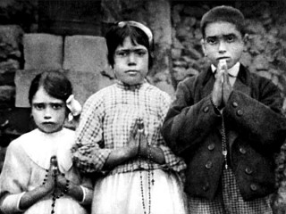 Portuguese shepherd children Lucia dos Santos, center, and her cousins, Jacinta and Francisco Marto, are seen in a file photo taken around the time of the 1917 apparitions of Mary at Fatima. (CNS photo/EPA) See VATICAN-LETTER-FATIMA March 30, 2017.