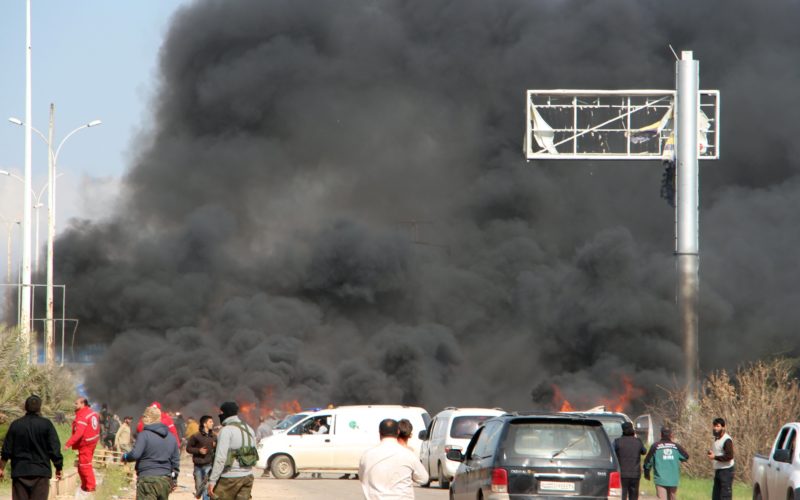 A picture taken on April 15, 2017, shows smoke billowing following a suicide car bombing in Rashidin, west of Aleppo, that targeted buses carrying Syrians evacuated from two besieged government-held towns of Fuaa and Kafraya. At least 40 people were killed in a suicide car bombing near buses carrying Syrians evacuated from two besieged government-held towns, the Syrian Observatory for Human Rights said. / AFP PHOTO / Ibrahim YASOUF (Photo credit should read IBRAHIM YASOUF/AFP/Getty Images)