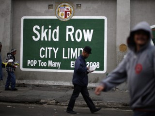 People walk around Skid Row in Los Angeles March 2. Catholic advocates are pushing Congress for a budget that protects poor people. (CNS photo/Lucy Nicholson, Reuters) See WASHINGTON LETTER March 19, 2015.