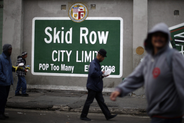 People walk around Skid Row in Los Angeles March 2. Catholic advocates are pushing Congress for a budget that protects poor people. (CNS photo/Lucy Nicholson, Reuters) See WASHINGTON LETTER March 19, 2015.