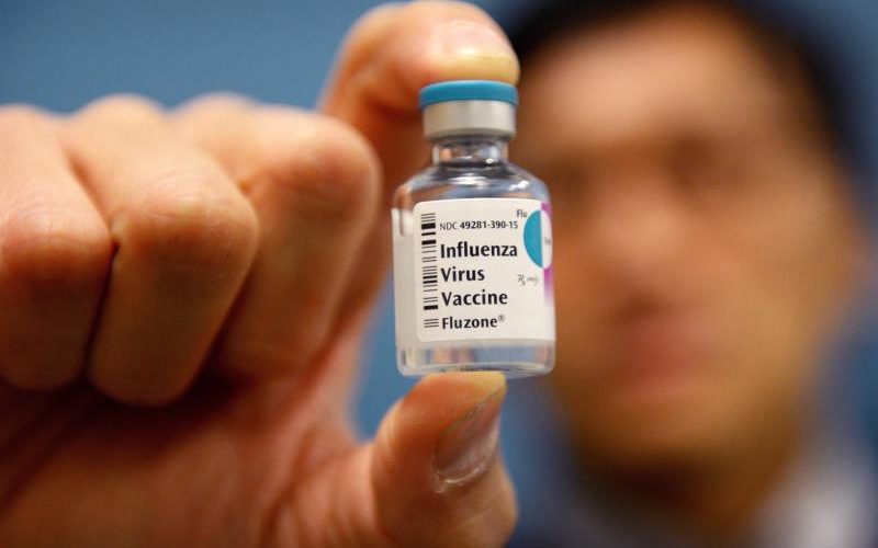 A doctor in New York City holds a flu vaccination vial Jan. 10, 2013. The American Health Care Act that passed by a four-vote margin May 4 in the House has "major defects," said Bishop Frank J. Dewane of Venice, Florida, chairman of the U.S. bishops' Committee on Domestic Justice and Social Development. (CNS photo/Justin Lane, EPA) See HEALTH-CARE-REACT May 5, 2017.