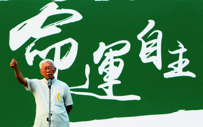 Cardinal Joseph Zen, 82, retired bishop of Hong Kong, addresses a rally outside government headquarters in Hong Kong, Sept. 24. Hundreds of students marched through the financial center chanting pro-democracy slogans and demands for free elections. (CNS photo/Liau Chung-ren, Reuters)