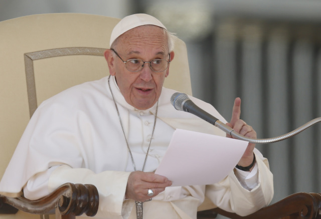 Pope Francis speaks during his general audience in St. Peter's Square at the Vatican March 15. (CNS photo/Paul Haring) See POPE-AUDIENCE-DIGNITY March 15, 2017.