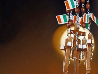 Rosaries tagged with Irish flags hang in a religious shop in Knock, Ireland, June 10. Knock is a center for Marian pilgrimage and devotion. (CNS photo/Cathal McNaughton, Reuters) (June 10, 2009)