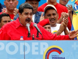 Venezuelan President Nicolas Maduro delivers a speech in Caracas during the closing campaign ceremony for the July 27 Constituent Assembly election. The banner reads "Power". (CNS photo/Carlos Garcias, Reuters) See VENEZUELA-BISHOPS-CRISIS July 28, 2017.