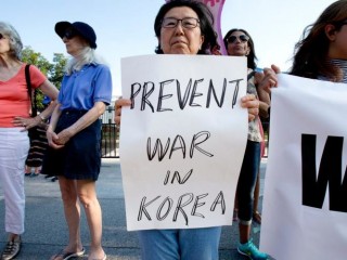 Nuclear war protesters demonstrate outside the White House in Washington Aug. 9. Church officials called for dialogue to ease U.S.-North Korea tensions. (CNS photo/Tyler Orsburn) See US-KOREA-TOMASI and US-KOREA-DIPLOMACY Aug. 10, 2017.