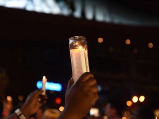 Vigil_racism_candle_Credit_a_katz_Shutterstock_CNA