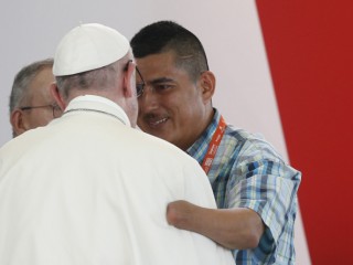 Pope Francis embraces man who spoke during a national reconciliation prayer meeting at Las Malocas Park in Villavicencio, Colombia, Sept. 8. (CNS photo/Paul Haring) See POPE-COLOMBIA-RECONCILIATION Sept. 8, 2017.