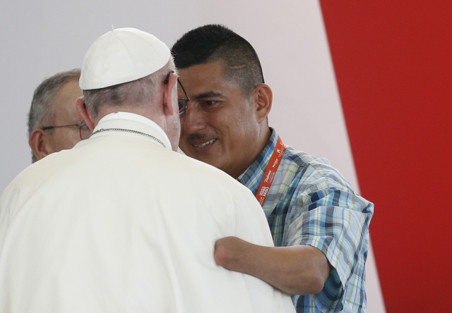 Pope Francis embraces man who spoke during a national reconciliation prayer meeting at Las Malocas Park in Villavicencio, Colombia, Sept. 8. (CNS photo/Paul Haring) See POPE-COLOMBIA-RECONCILIATION Sept. 8, 2017.