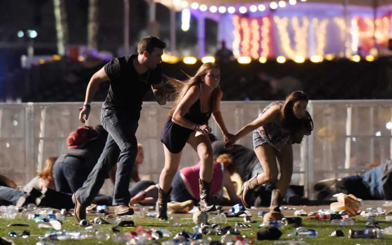 LAS VEGAS, NV - OCTOBER 01: People run from the Route 91 Harvest country music festival after apparent gun fire was hear on October 1, 2017 in Las Vegas, Nevada. A gunman has opened fire on a music festival in Las Vegas, leaving at least 20 people dead and more than 100 injured. Police have confirmed that one suspect has been shot. The investigation is ongoing. (Photo by David Becker/Getty Images)