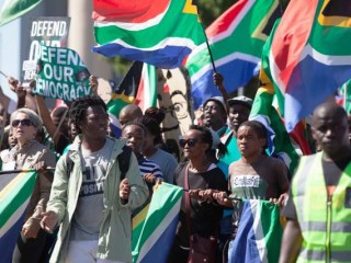 Protesters_march_to_parliament_in_protest_at_President_Jacob_Zuma_Credit_Aqua_Images_Shutterstock_CNA