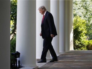 President Donald Trump enters the Rose Garden at the White House to announce his decision to leave the Paris climate agreement June 1. (CNS phot/Joshua Roberts, Reuters) See BISHOPS-TRUMP-PARIS-CLIMATE June 1, 2017.