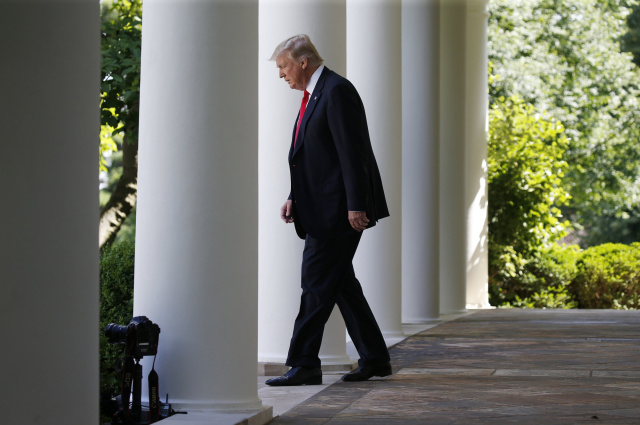 President Donald Trump enters the Rose Garden at the White House to announce his decision to leave the Paris climate agreement June 1. (CNS phot/Joshua Roberts, Reuters) See BISHOPS-TRUMP-PARIS-CLIMATE June 1, 2017.