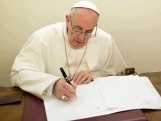 Pope-Francis-writing-740x493