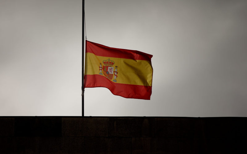 SANTIAGO DE COMPOSTELA, SPAIN - JULY 28: A Spanish flag flies at half mast on top of Santiago First Court building while preliminar judge Luis Alaez is asking for declaration to Jose Garzon Amo, Santiago high speed train crash driver, on July 28, 2013 in Santiago de Compostela, Spain. The high speed train crashed after it derailed on a bend as it approached the north-western Spanish city of Santiago de Compostela at 8:40pm on July 24th. At least 78 people have died and a further 131 are reported injured. The crash occurred on the eve of the Santiago de Compostela Festivities. The train driver, Garzon Amo, has been formally accused of reckless homicide and remains in custody awaiting an appearance in court. (Photo by Gonzalo Arroyo/Getty Images)