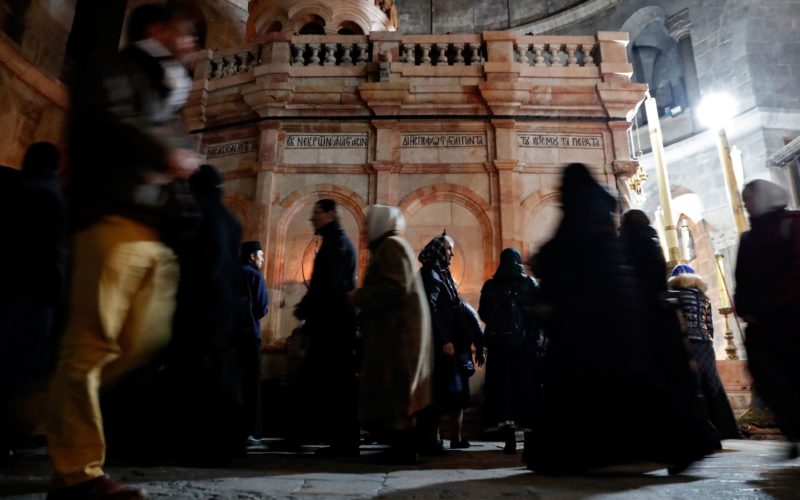 Christian worshippers pray inside the Church of the Holy Sepulchre in Jerusalem after it reopened on February 28, 2018, following a three-day closure to protest against Israeli tax measures and a proposed law. Jerusalem's Church of the Holy Sepulchre, seen by many as the holiest site in Christianity, reopened on February 28 after a three-day closure to protest against Israeli tax measures and a proposed law. / AFP PHOTO / THOMAS COEX (Photo credit should read THOMAS COEX/AFP/Getty Images)