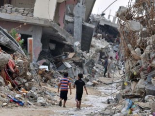Children_2_amidst_the_devastated_buildings_in_Gaza_Credit_Shareef_Sarhan_CRS_CNA_7_22_15-690x450
