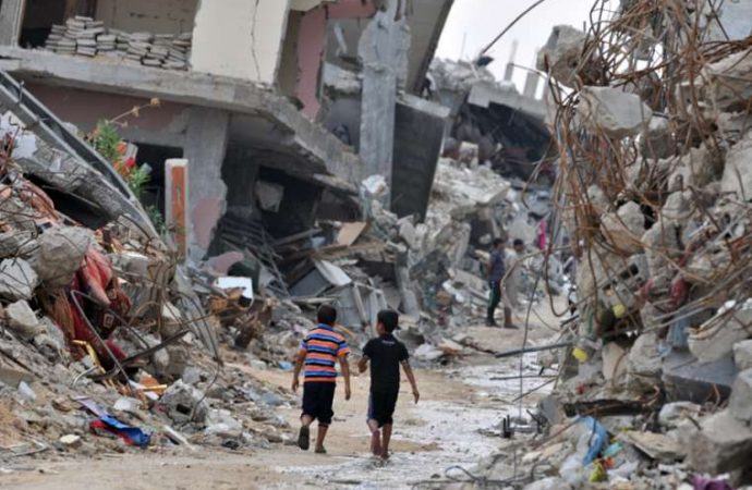Children_2_amidst_the_devastated_buildings_in_Gaza_Credit_Shareef_Sarhan_CRS_CNA_7_22_15-690x450