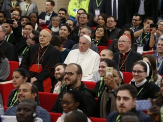 Cardinal Lorenzo Baldisseri, secretary-general of the Synod of Bishops, Pope Francis and Cardinal Kevin Farrell, prefect of the Dicastery for Laity, the Family and Life, pose for a photo during a pre-synod gathering of youth delegates in Rome March 19. A new document from the International Theological Commission explores the pope's call for the church to be "synodal" and emphasizes the role of the laity in the mission of the church. (CNS photo/Paul Haring) See SYNODALITY-THEOLOGICAL-COMMISSION May 7, 2018.
