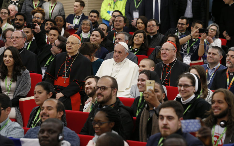 Cardinal Lorenzo Baldisseri, secretary-general of the Synod of Bishops, Pope Francis and Cardinal Kevin Farrell, prefect of the Dicastery for Laity, the Family and Life, pose for a photo during a pre-synod gathering of youth delegates in Rome March 19. A new document from the International Theological Commission explores the pope's call for the church to be "synodal" and emphasizes the role of the laity in the mission of the church. (CNS photo/Paul Haring) See SYNODALITY-THEOLOGICAL-COMMISSION May 7, 2018.