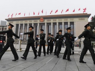 Chinese soldiers march outside the Great Hall of the People in Beijing, before the introduction of the Communist Party of China's Politburo Standing Committee, the nation's top decision-making body, on October 25, 2017.
China on October 25 unveiled its new ruling council with President Xi Jinping firmly at the helm after stamping his authority on the country by engraving his name on the Communist Party's constitution. / AFP PHOTO / GREG BAKER        (Photo credit should read GREG BAKER/AFP/Getty Images)