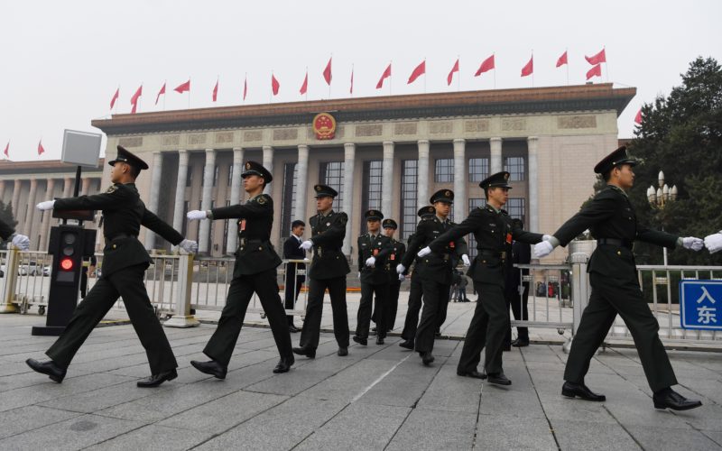 Chinese soldiers march outside the Great Hall of the People in Beijing, before the introduction of the Communist Party of China's Politburo Standing Committee, the nation's top decision-making body, on October 25, 2017. China on October 25 unveiled its new ruling council with President Xi Jinping firmly at the helm after stamping his authority on the country by engraving his name on the Communist Party's constitution. / AFP PHOTO / GREG BAKER (Photo credit should read GREG BAKER/AFP/Getty Images)