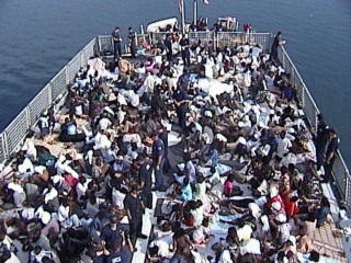 CARIBBEAN SEA (Nov. 16)--A view of the Coast Guard Cutter Legare's flight deck with most of the 301 migrants on board.  The Coast Guard Cutter Legare rescue 301 haitian migrants off the coast of Haiti between Wednesday afternoon and late Friday evening.  U. S.  COAST GUARD PHOTO