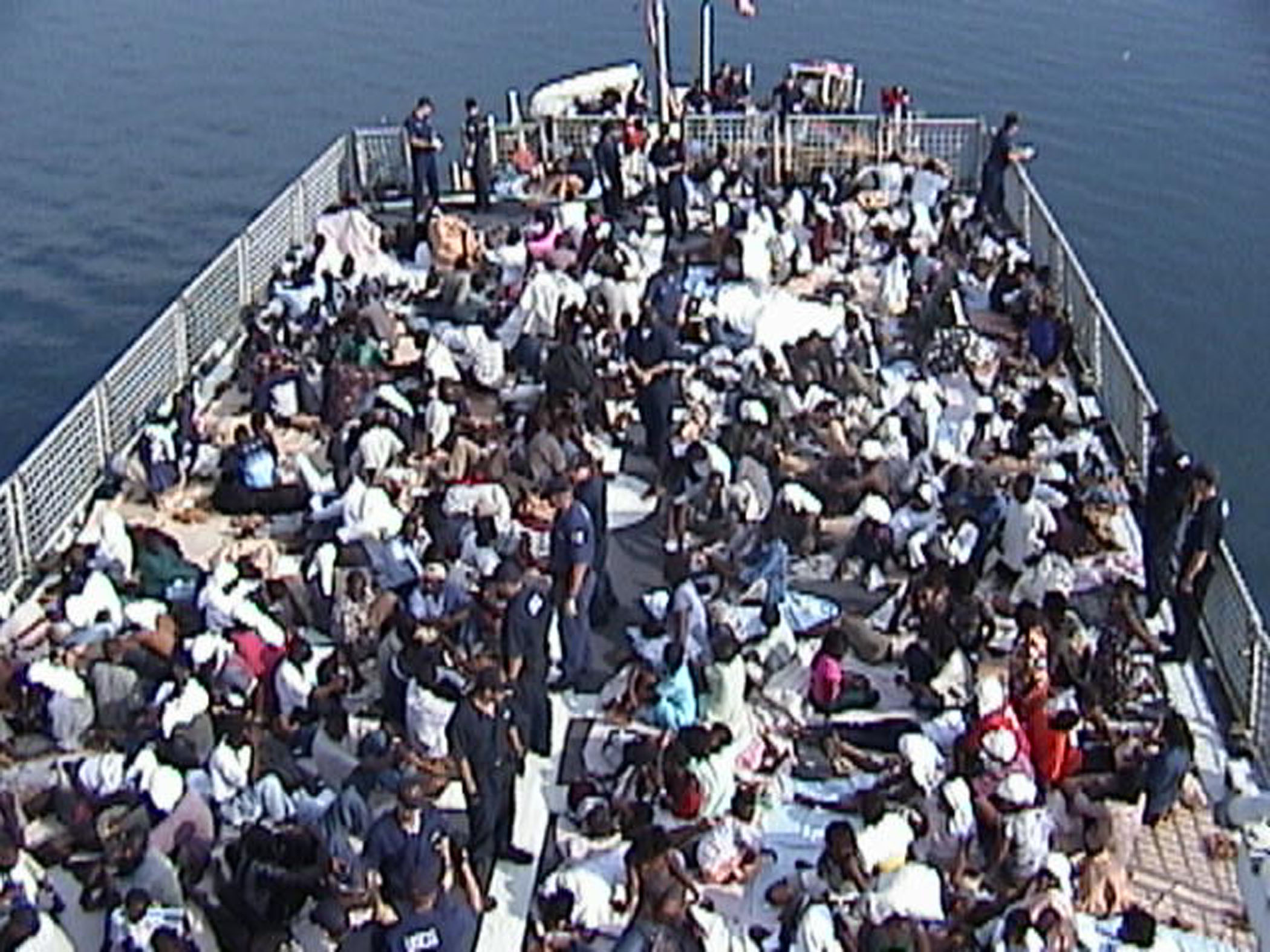 CARIBBEAN SEA (Nov. 16)--A view of the Coast Guard Cutter Legare's flight deck with most of the 301 migrants on board. The Coast Guard Cutter Legare rescue 301 haitian migrants off the coast of Haiti between Wednesday afternoon and late Friday evening. U. S. COAST GUARD PHOTO