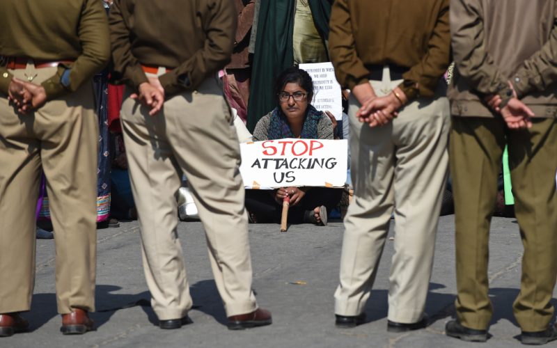 Policewomen keep watch as minority Indian Christians demonstrate outside the Sacred Heart Cathedral following recent attacks on churches in New Delhi on February 5, 2015. Hundreds of minority Christians protested outside a church in the Indian capital February 5 as priests and demonstrators said they feel insecure under Prime Minister Narendra Modi's government after a series of unsolved attacks on churches in the city. AFP PHOTO / SAJJAD HUSSAIN (Photo credit should read SAJJAD HUSSAIN/AFP/Getty Images)