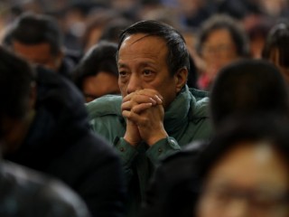 A man prays during a 2017 Mass at the Cathedral of the Immaculate Conception in Beijing. As rumors fly of an imminent Vatican-China deal on the appointment of bishops, a Belgian priest known as an expert on China said he thinks an agreement might really happen. (CNS photo/Wu Hong) See CHINA-DEAL-HEYNDRICKX March 21, 2018.