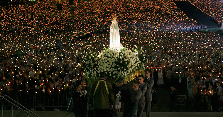 Portugal: A statue of the Holy Virgin Mary of Fatima is carried