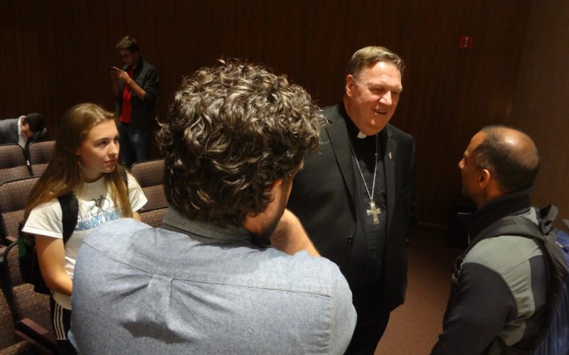 Cardinal Joseph W. Tobin of Newark, N.J., visits with Notre Dame students following an Aug. 30 lecture on "awakening the American heart." Cardinal Tobin addressed U.S. attitudes toward immigrants and, responding to questions afterward, said he saw the Holy Spirit at work in the abuse crisis, "like a hurricane" smashing structures. (CNS photo/Don Clemmer, Our Sunday Visitor) See TOBIN-NOTRE-DAME Sept. 5, 2018.