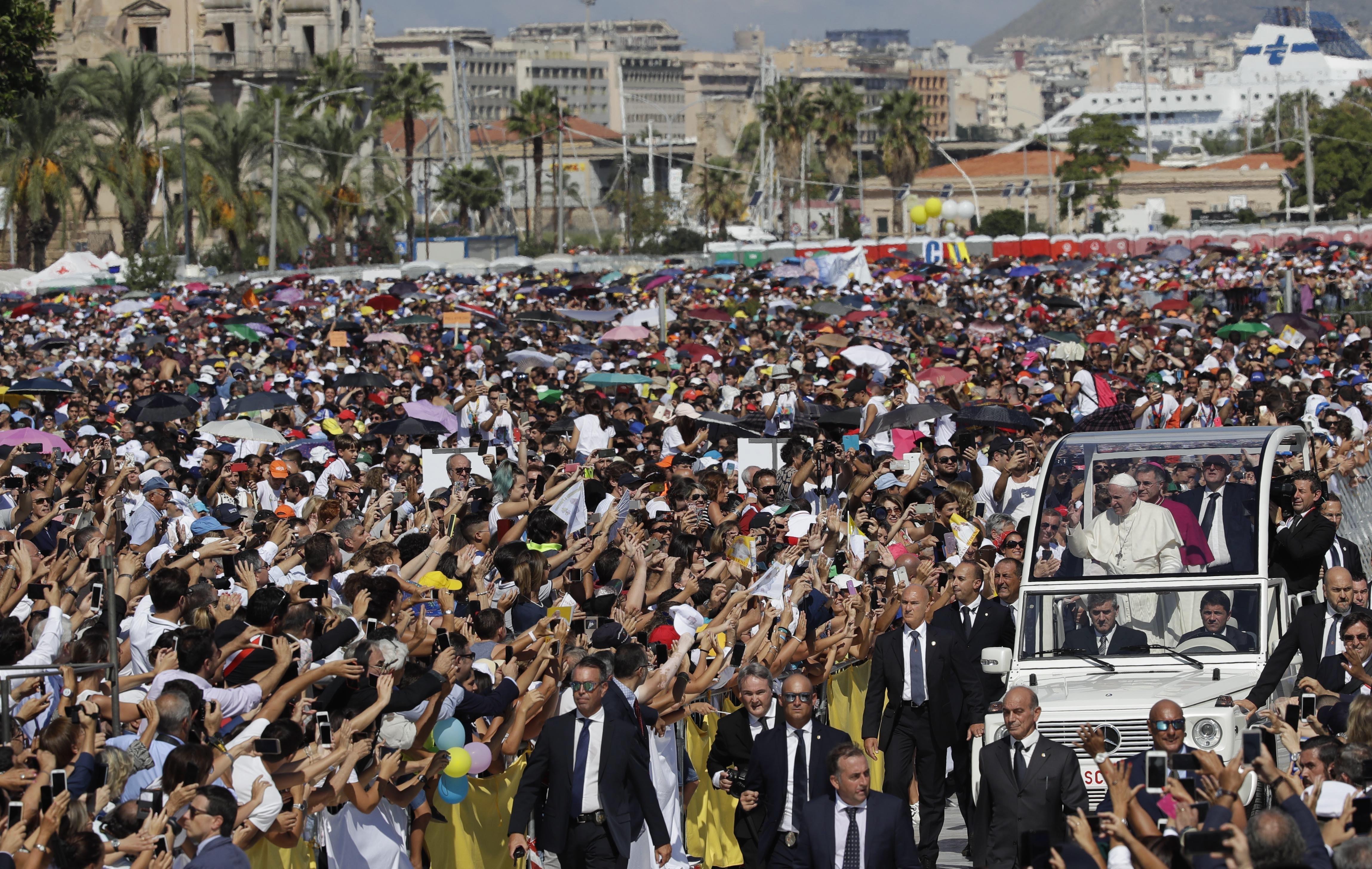 Pope Francis is driven through the crowd in Palermo, Italy, Saturday, Sept. 15, 2018. Pope Francis is paying tribute in Sicily to a priest who worked to keep youths away from the Mafia and was slain by mobsters. Francis has flown to the Mediterranean island on the 25th anniversary of the assassination in Palermo of the Rev. Giuseppe "Pino" Puglisi, who has been declared a martyr by the Vatican. (AP Photo/Alessandra Tarantino) ORG XMIT: FP106
