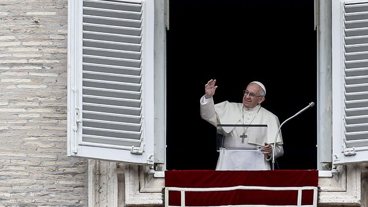 Pope Francis waves to the crowds at the Sunday Angelus 0