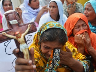 Pakistani Christians protest against the suicide bombing in All Saints church in the northwestern city of Peshawar on September 23, 2013. The death toll from a double suicide bombing on a church in Pakistan rose to 81, as Christians protested across the country to demand better protection for their community.  AFP PHOTO/ A MAJEED        (Photo credit should read A Majeed/AFP/Getty Images)