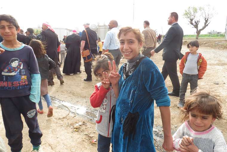 Cardinal_Timothy_Dolan_of_New_York_11_visits_a_displacement_center_in_Dawodiya_Iraq_on_April_10_2016_Credit_Elise_Harris_CNA_4_10_16