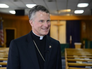 Archbishop Timothy Broglio, Archbishop of the Military Services, smiles during an interview at the chapel on Osan Air Base, Republic of Korea, Aug. 26, 2015. Broglio recently stopped by Osan AB, along with various military installations on the Korean peninsula to visit with service members and their families who are part of the Catholic community.  (U.S. Air Force photo/Senior Airman Kristin High)