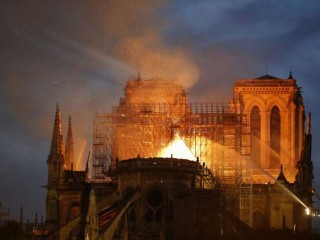 Firefighters_douse_flames_billowing_from_the_roof_at_Notre_Dame_Cathedral_in_Paris_April_15_2019_Credit_Francois_Guillot_AFP_Getty_Images