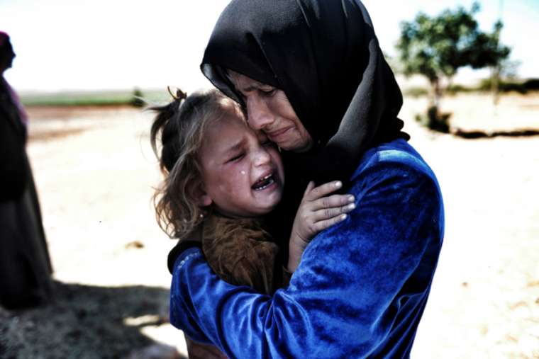 Refugees_flee_the_Syrian_Civil_War_in_2015_Creditquetions123__Shutterstock__CNA