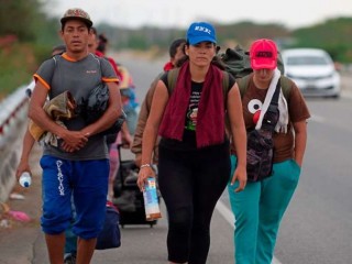 Venezuelan_migrants_walk_southbound_along_the_Pan_American_highway_after_receiving_refugee_permits_at_the_Peruvian_border_Credit_Cris_Bouroncle__AFP__Getty_Images