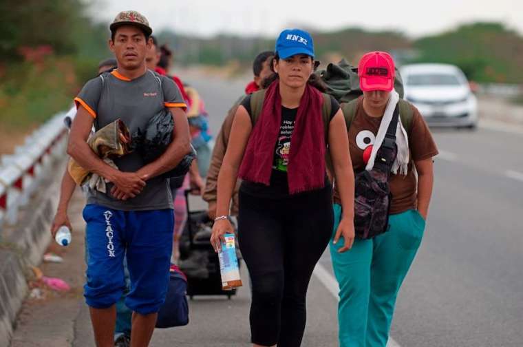 Venezuelan_migrants_walk_southbound_along_the_Pan_American_highway_after_receiving_refugee_permits_at_the_Peruvian_border_Credit_Cris_Bouroncle__AFP__Getty_Images