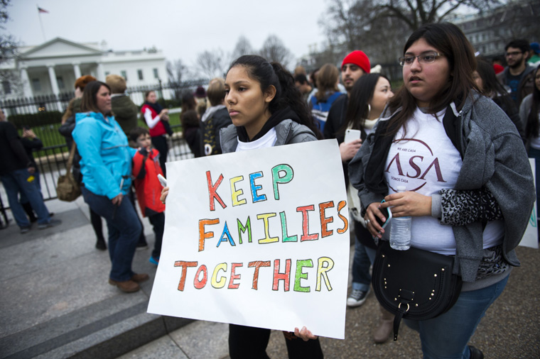 Immigration advocates demonstrate on Pennsylvania Avenue in front of the White House in Washington in this Dec. 30, 2015, file photo. (CNS photo/Shawn Thew/EPA) See SCOTUS-BRIEF-DACA-DAPA March 9, 2016.