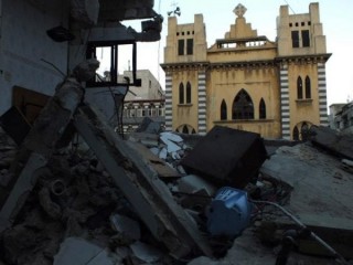 Một nhà thờ Công giáo Syriac bị hư hại được hình ở Homs, Syria. (Tín dụng: Yazen Homsy / Reuters qua CNS)