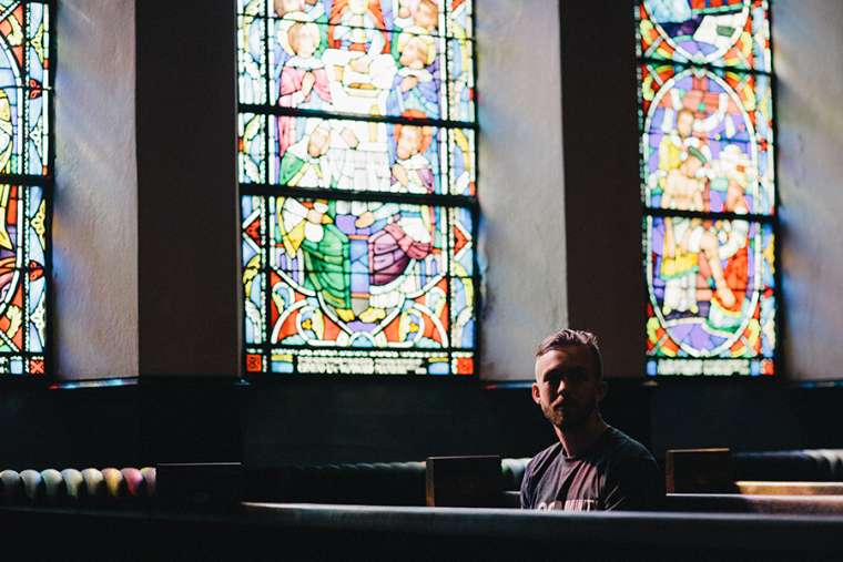 Young_man_church_Credit_Unsplash_CNA