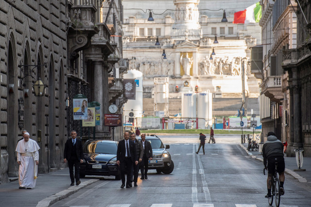 Pope Francis walks in a deserted Rome to pray at two shrines for the end of the coronavirus pandemic, in Rome