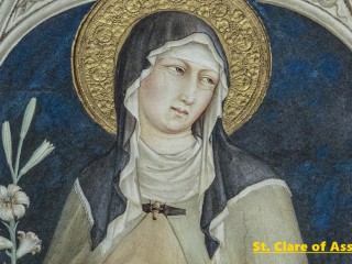 This mosaic in Assisi, Italy, photographed May 28, depicts St. Clare of Assisi holding a palm frond, a symbol of her entering religious life. She founded a religious order of women called the Poor Clares and is closely associated with St. Francis of Assisi. She maintained a life of poverty. Her feast day is Aug. 11. (CNS photo/Octavio Duran)